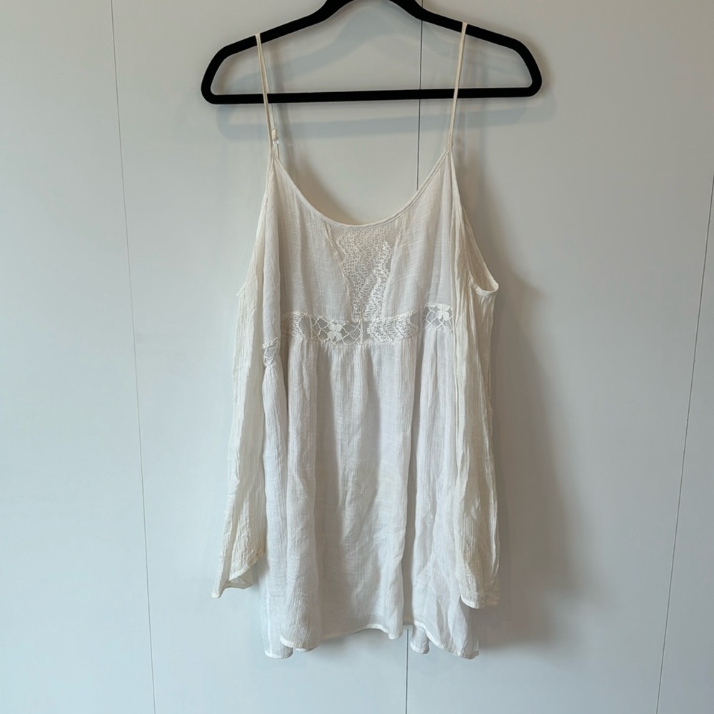 Flowy white mini dress with open shoulders